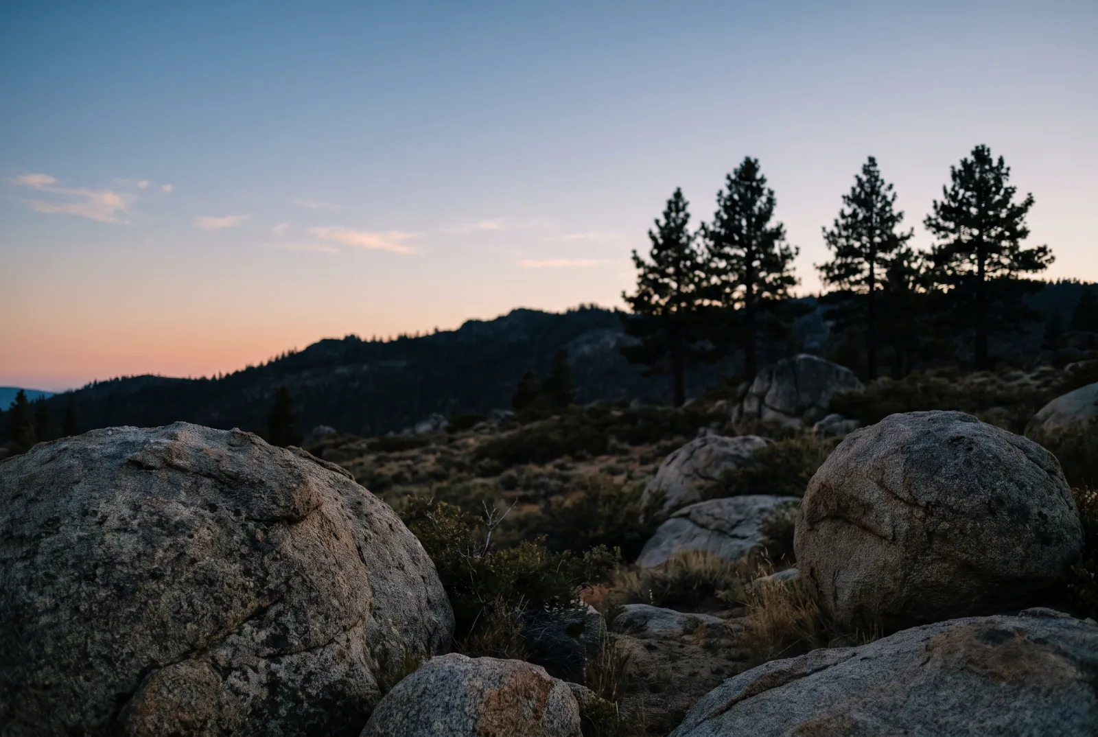 A granite ridge in the Sierra Nevada at dusk, the state line country